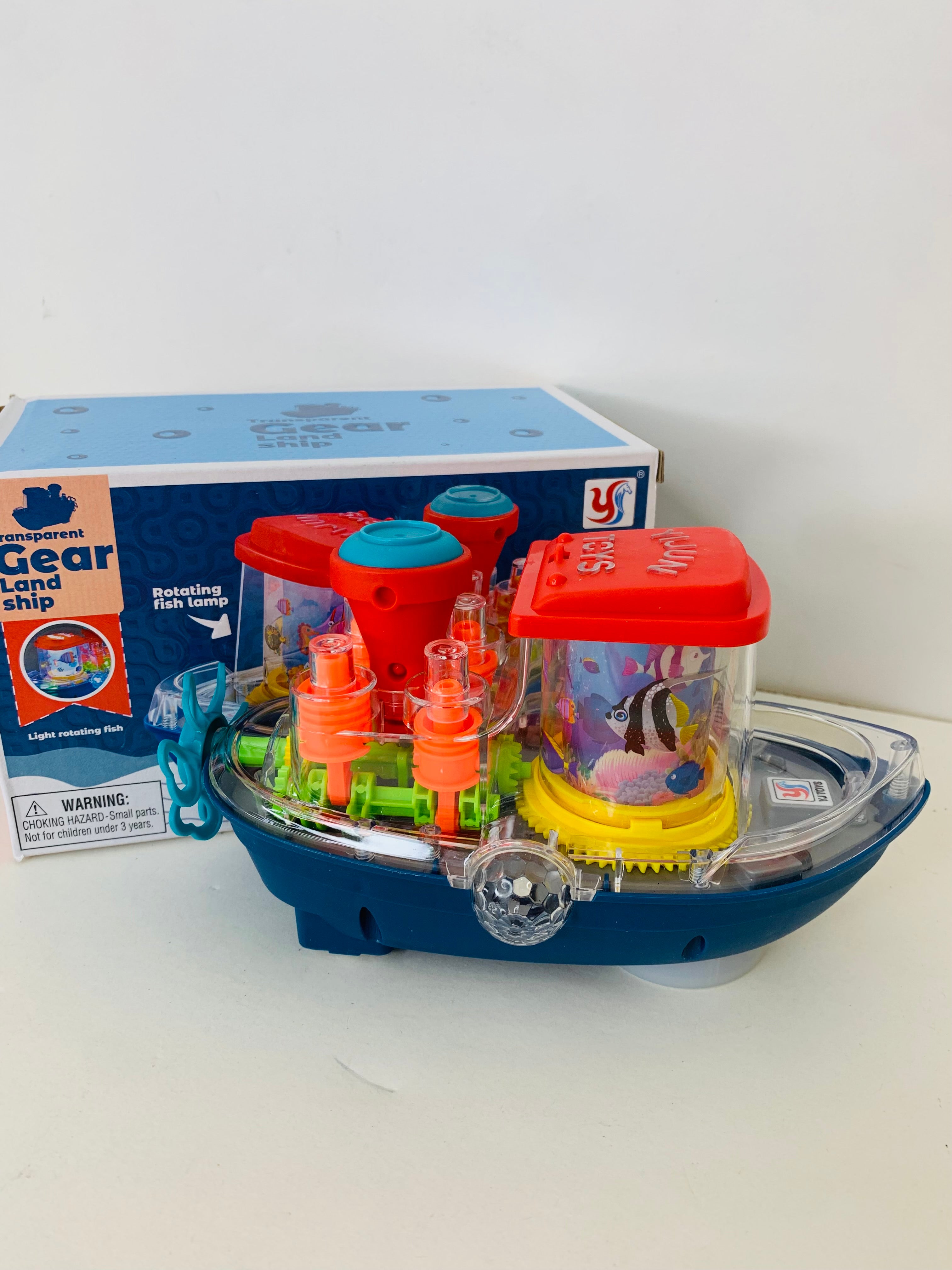 AquaGear™ Transparent Land Ship | Interactive Musical Boat Toy with Rotating Fish Lamp & Mechanical Gears 🚢🐟⚙️✨
